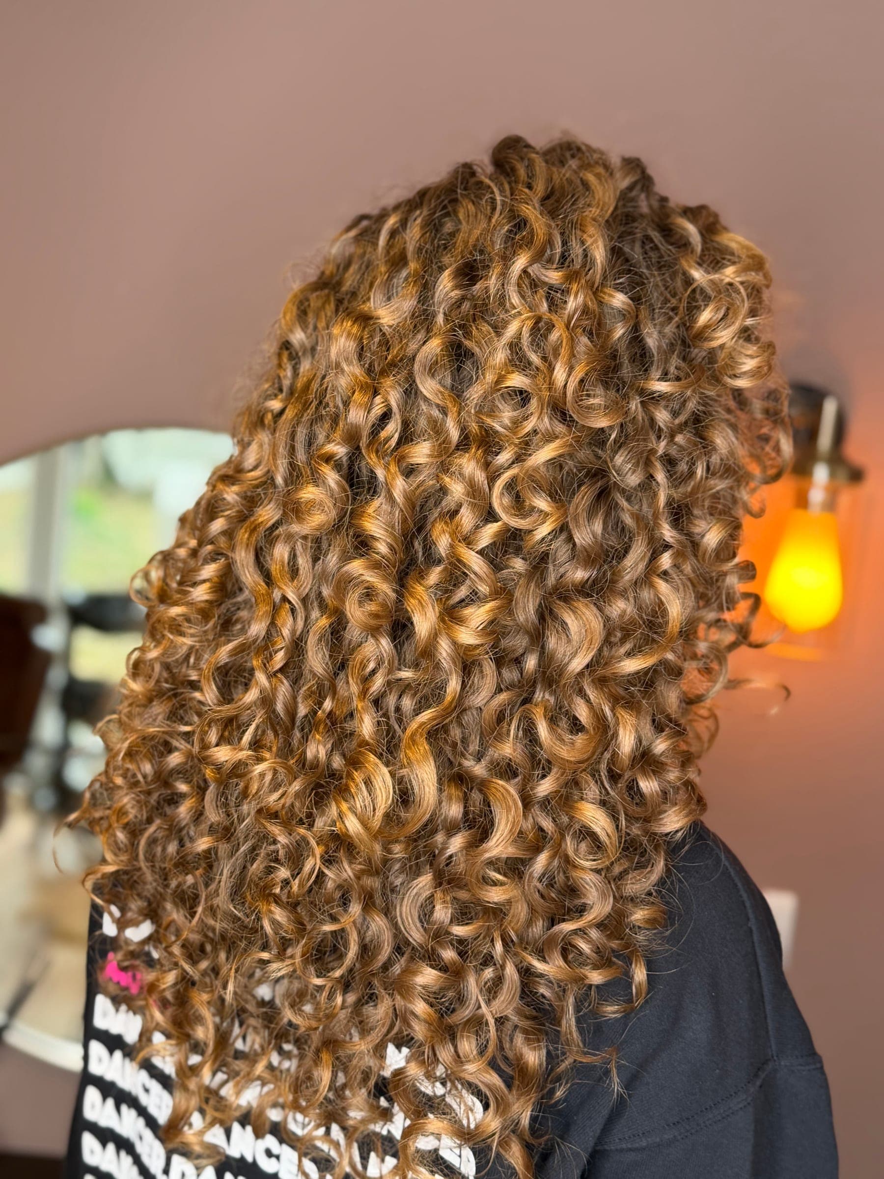 Long golden curls styled by Amanda