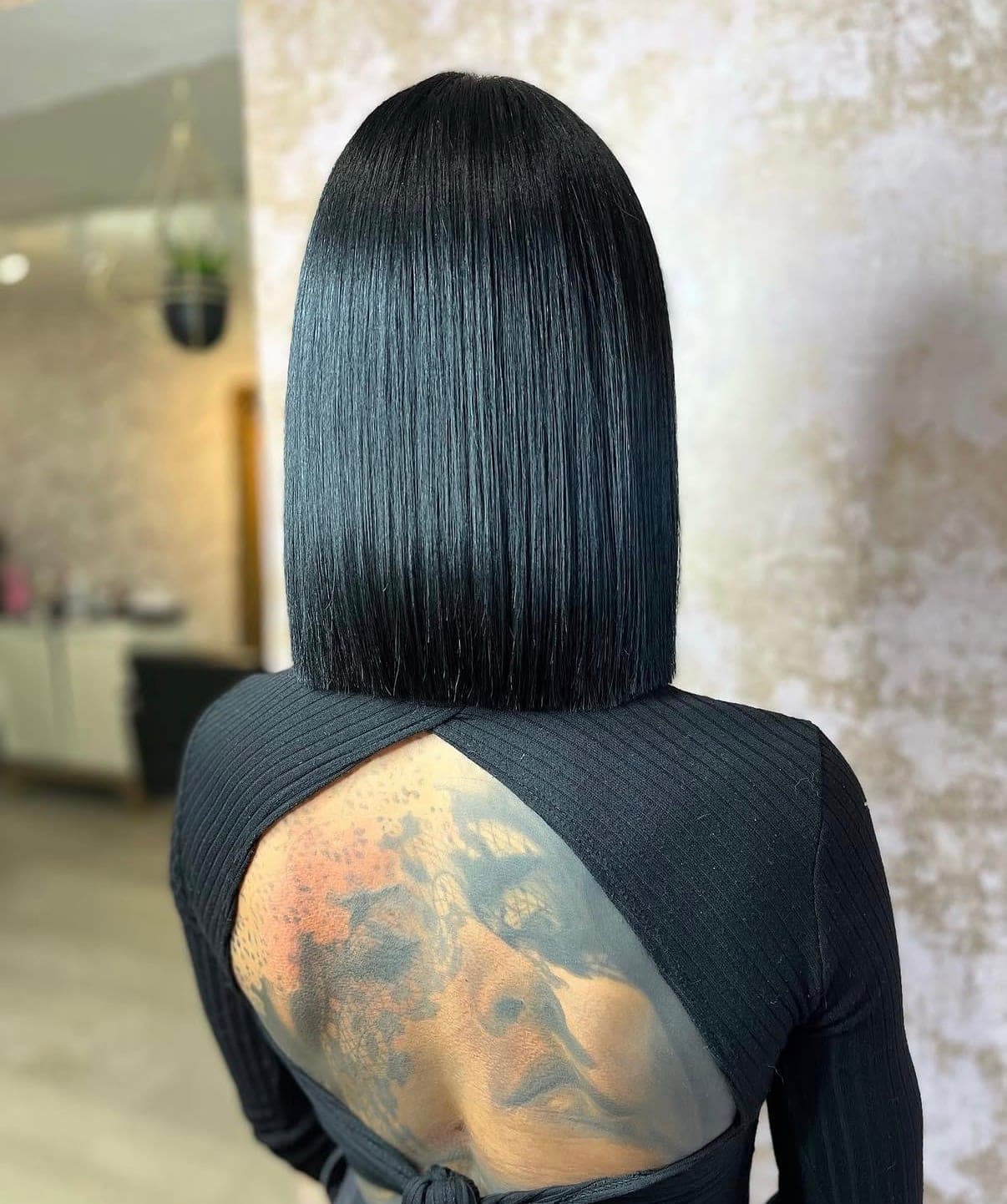 A precision one-length bob cut by Amanda, photographed from behind